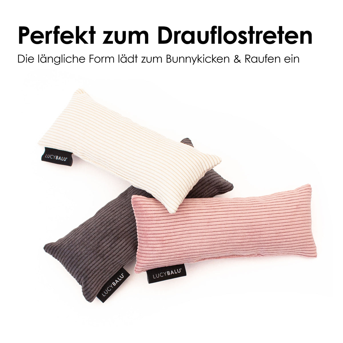 Drei längliche Bunny Kick Kissen aus Cord in Rosa, Creme und Anthrazit mit LucyBalu Label